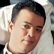 Alex Bueno, 62 (World Music Singer)