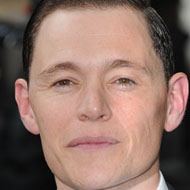 Burn Gorman, 49 (Ator do Filme)