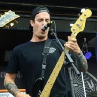 Oshie Bichar, 38 (Bassist)